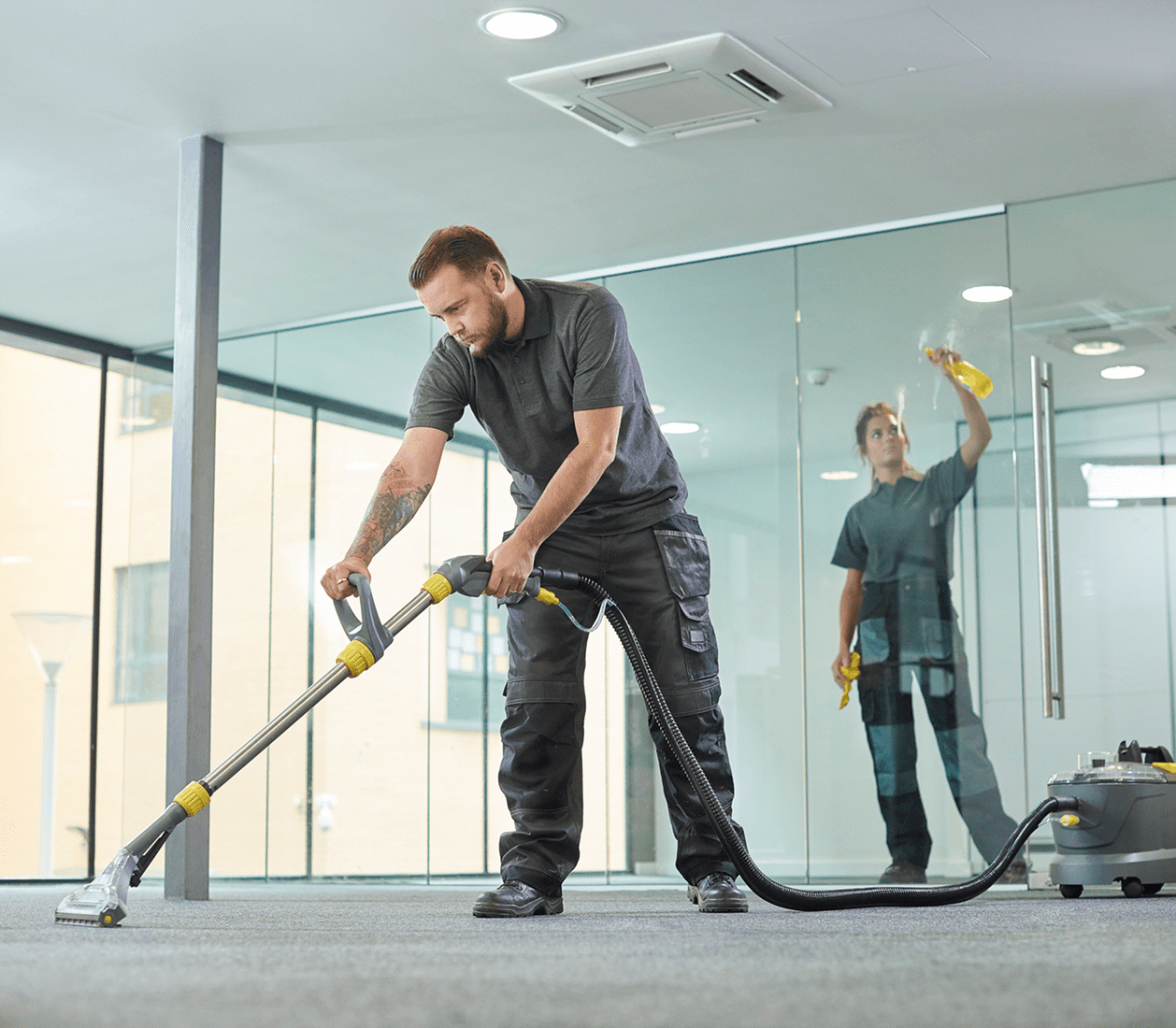 Office cleaning with vacuum and spray