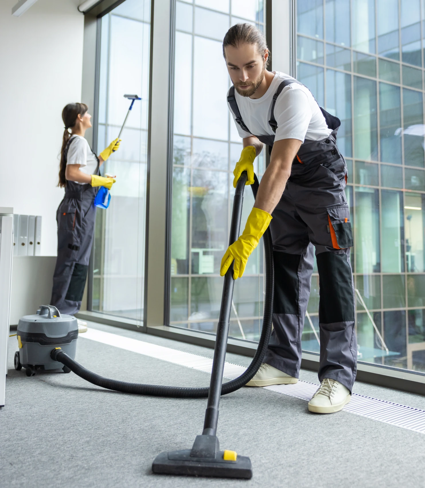 Cleaning crew vacuuming and washing windows